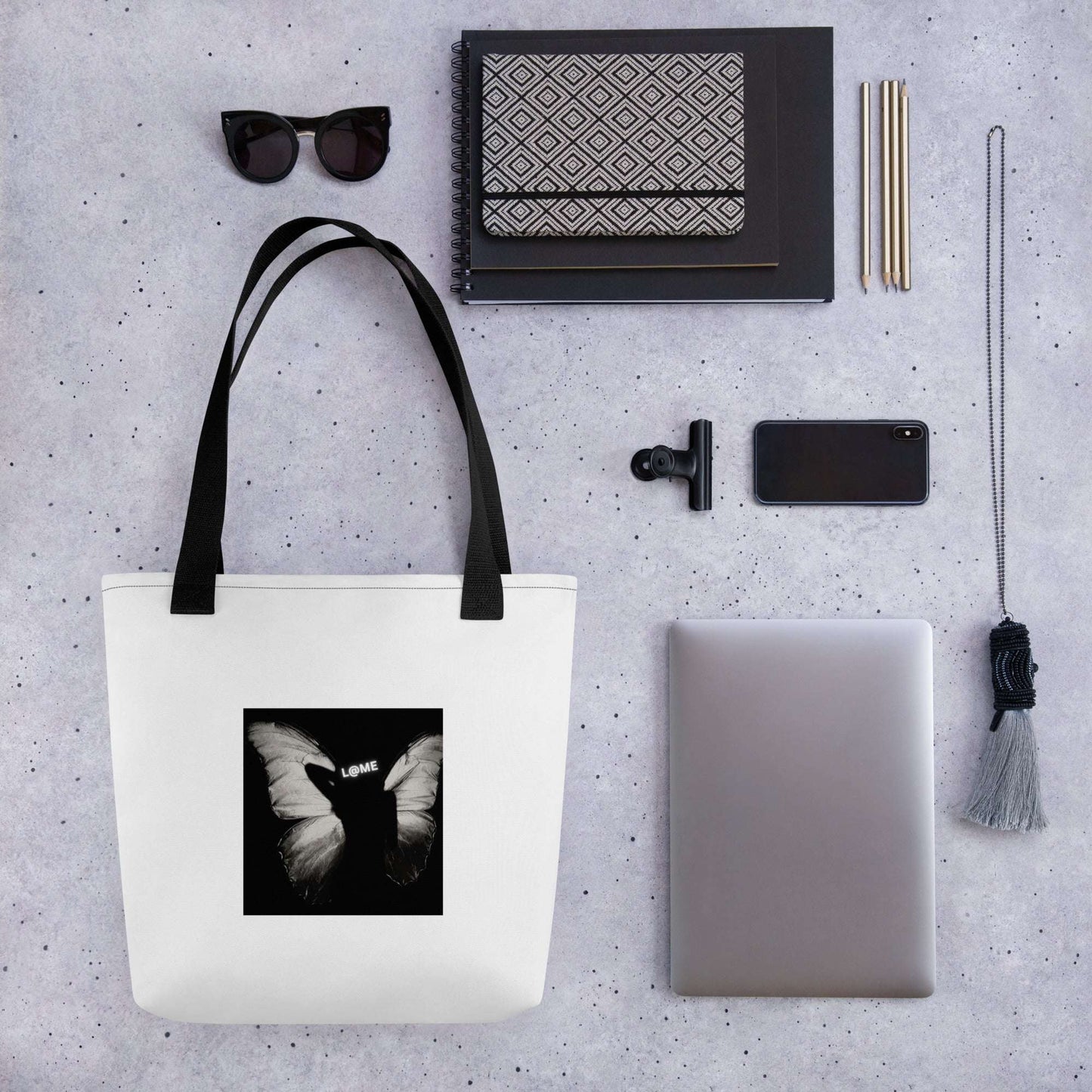 Durable 15x15 inch tote bag with butterfly print and bold L@ME graphic, cotton handles.
