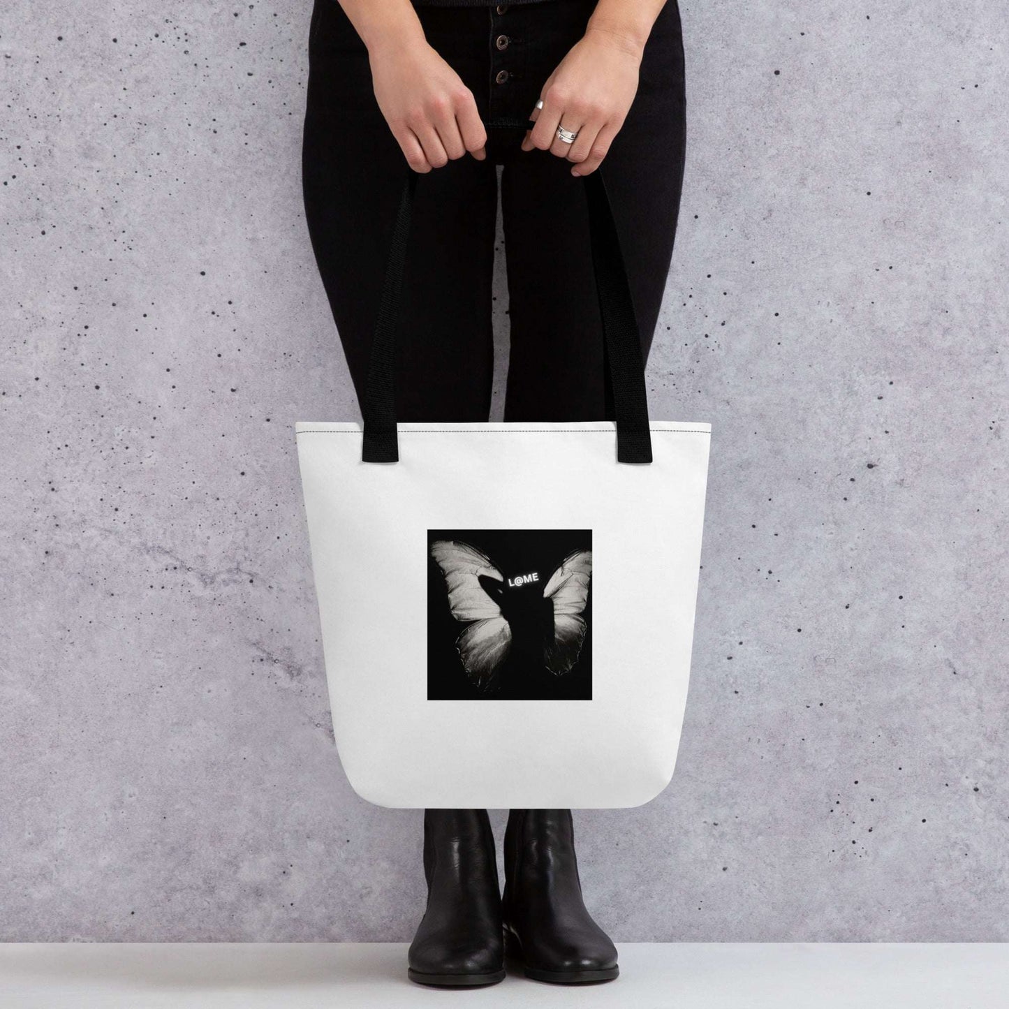 Durable tote bag with an all-over butterfly print and dual cotton handles.