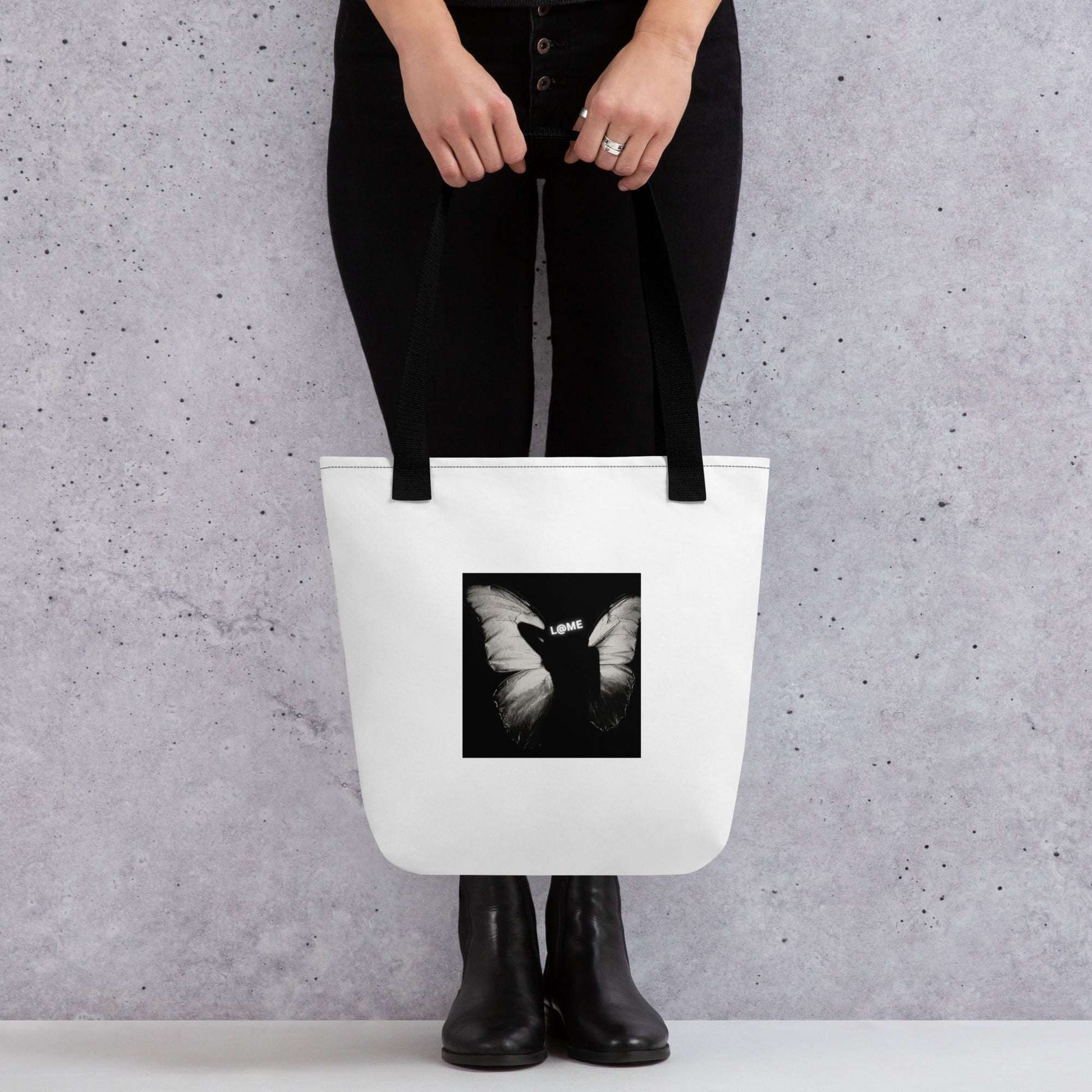 Durable tote bag with an all-over butterfly print and dual cotton handles.