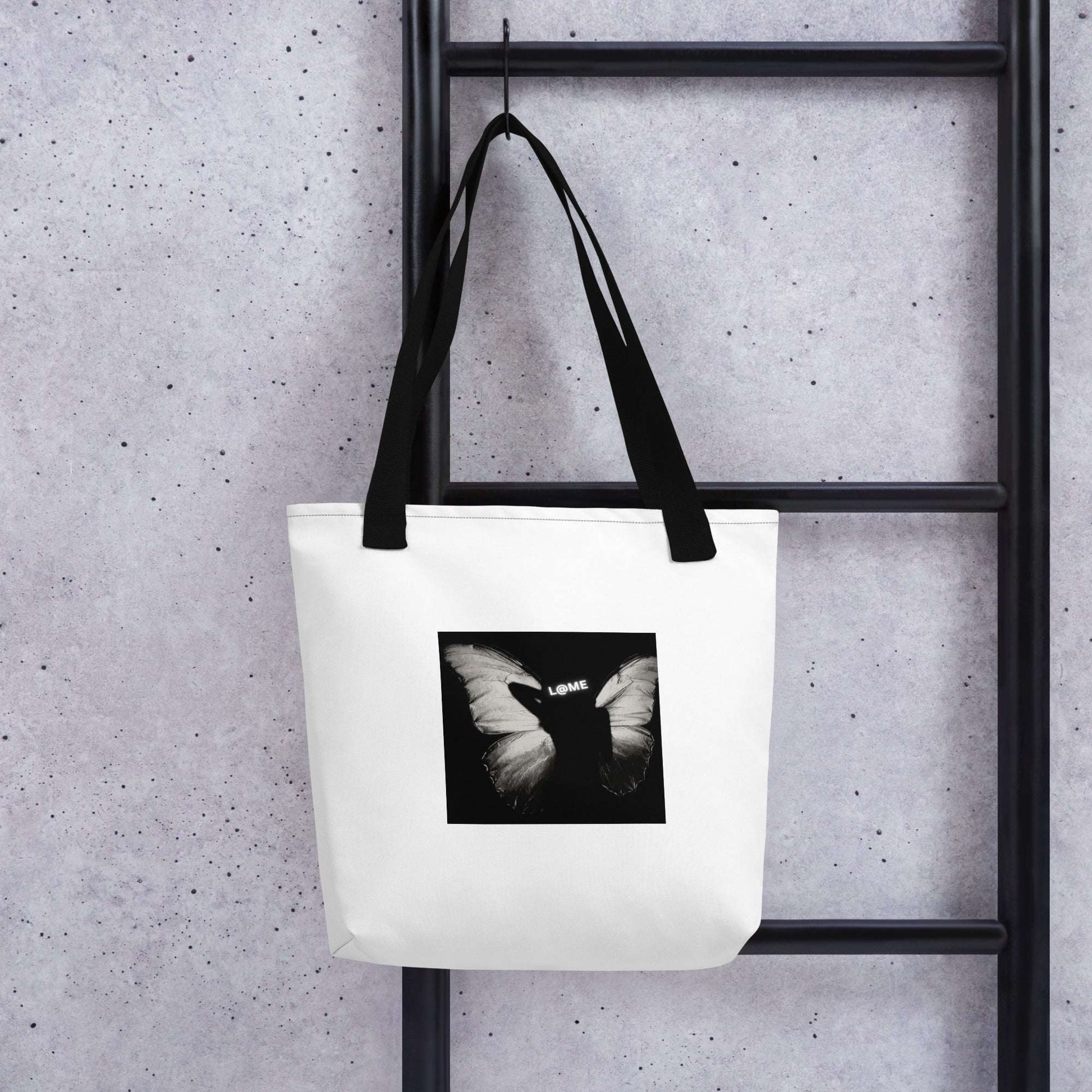 Durable tote bag with a butterfly print and dual cotton handles, measuring 15 inches square.