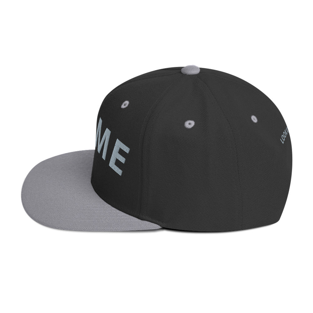 Structured green camo snapback hat with embroidered logo and flat brim.