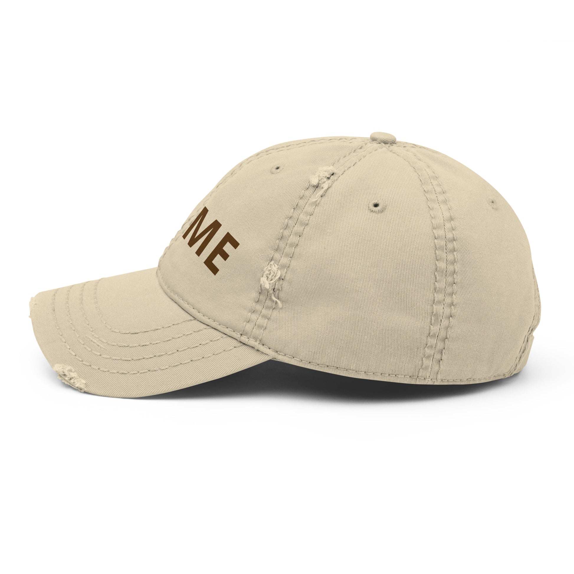 Distressed dad hat with a relaxed crown and frayed edges in soft cotton twill.