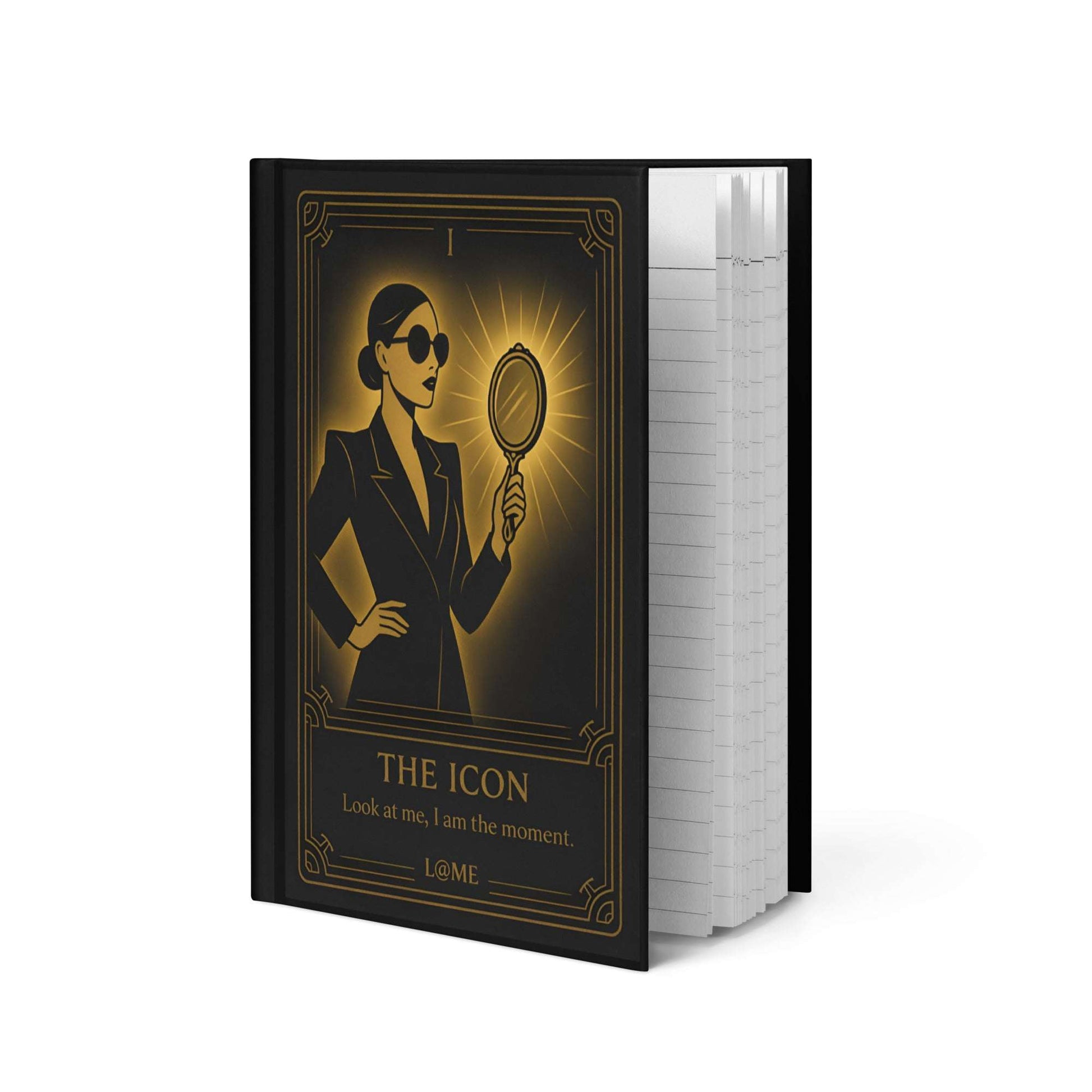 A matte hardcover journal with gold tarot-style artwork on a deep black cover.