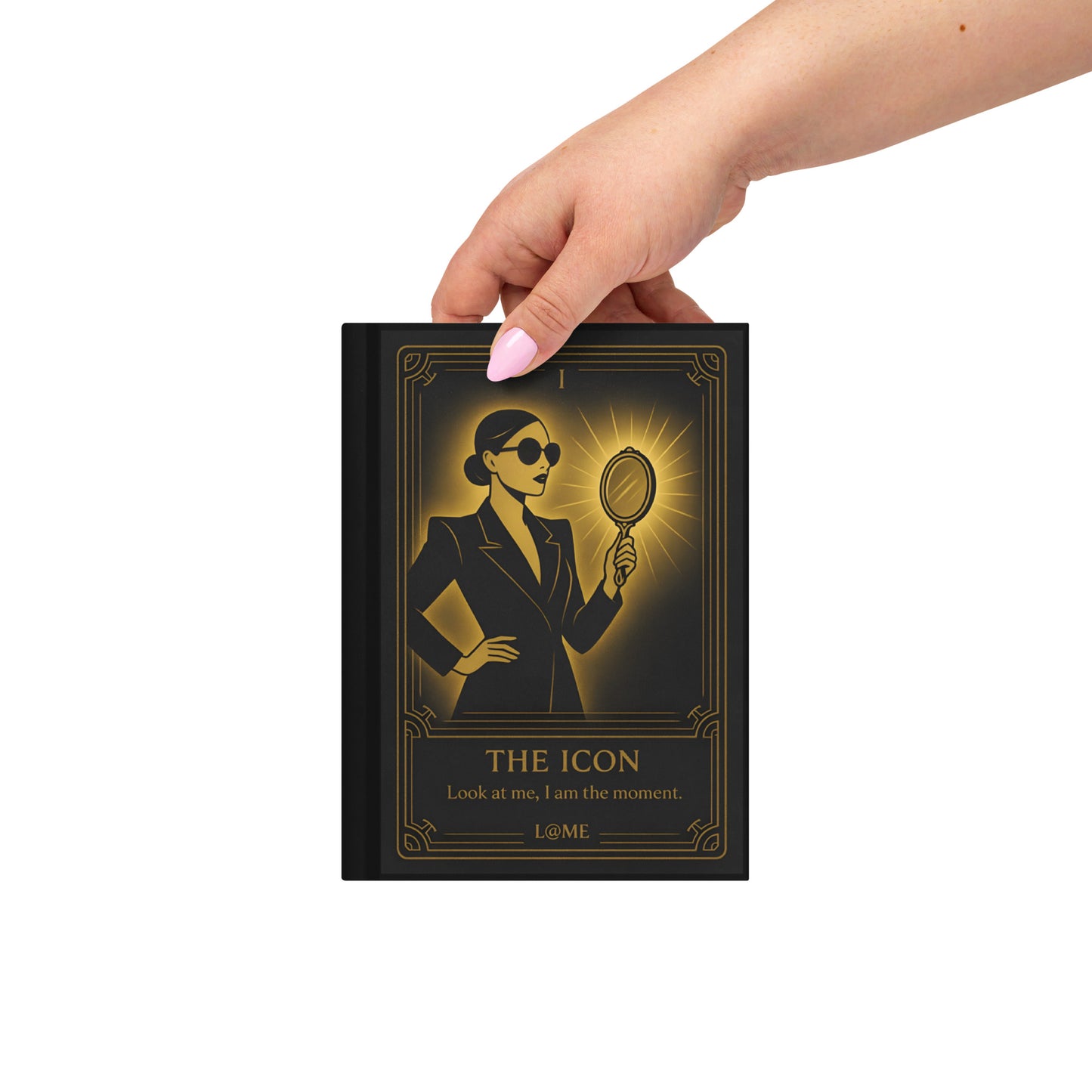 Matte hardcover journal with gold tarot-style artwork on a deep black cover.