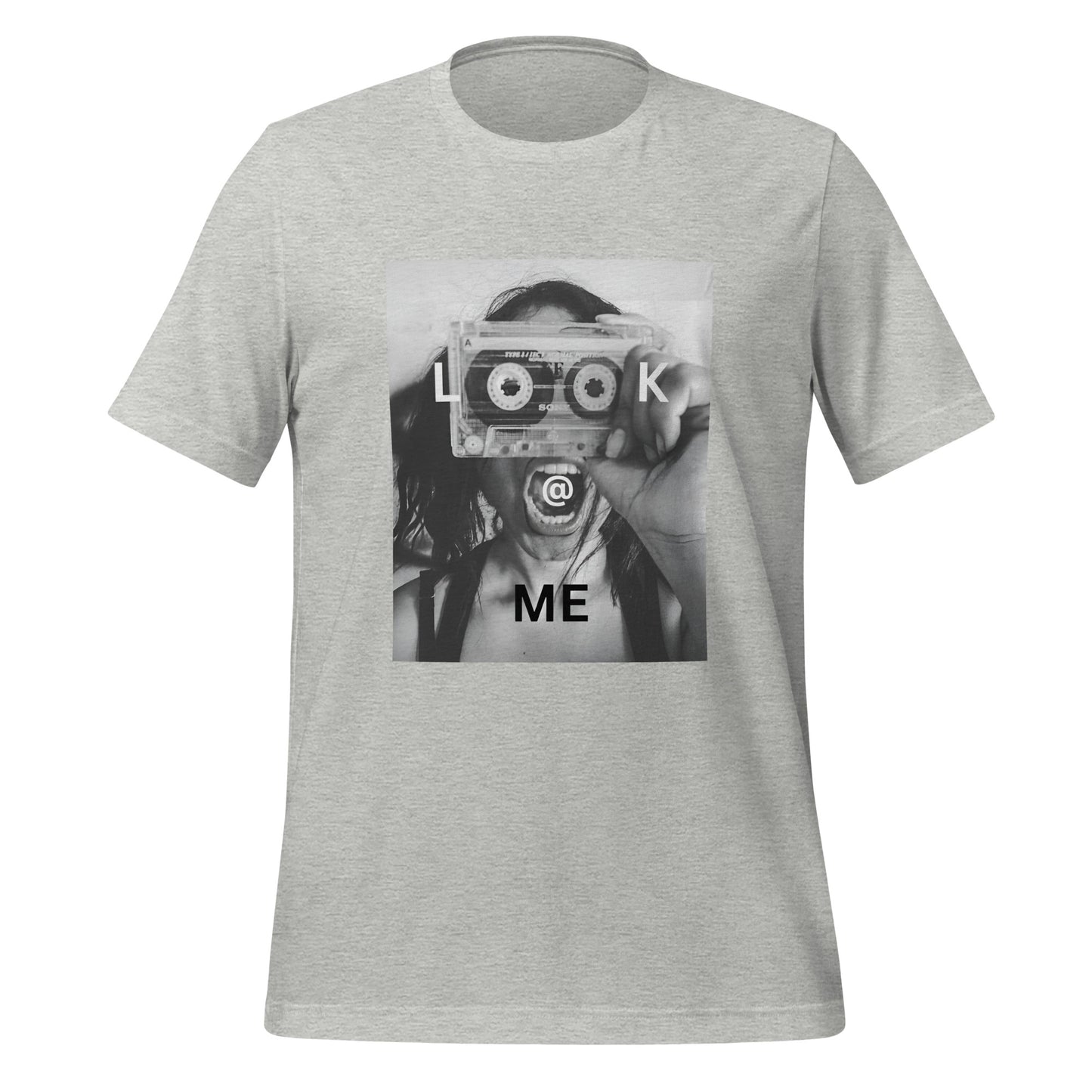 Monochrome tee featuring a woman holding a cassette like a camera, made of soft cotton.