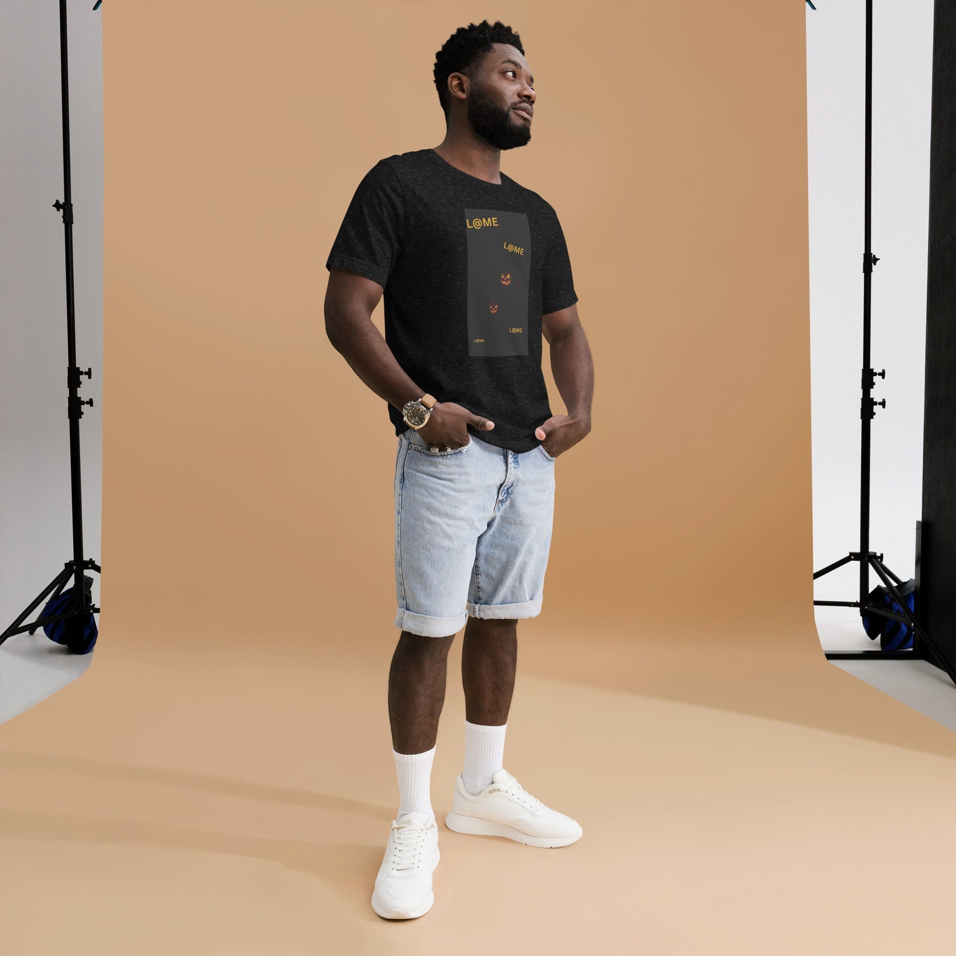 Black Halloween tee with subtle orange pumpkin faces and streetwear style design