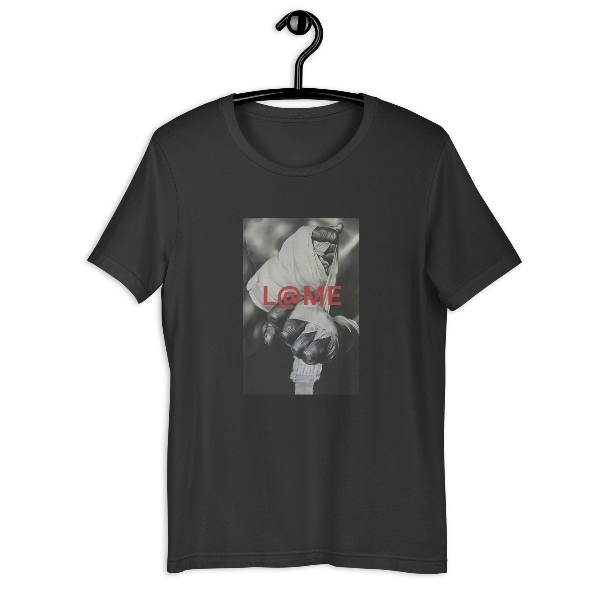 Close-up of a wrapped hand gripping tightly on a grayscale tee with red L@ME print.