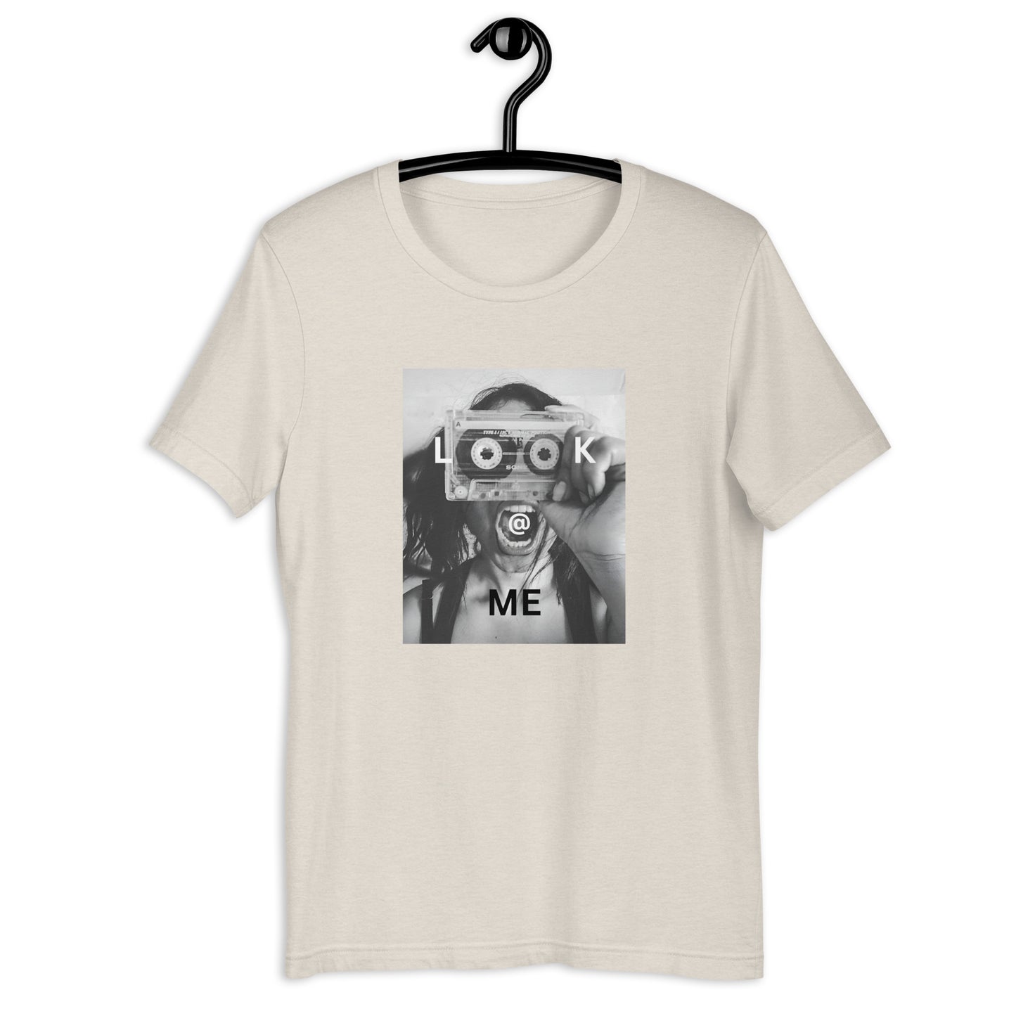 Monochrome tee featuring a woman holding a cassette like a camera in a striking design.