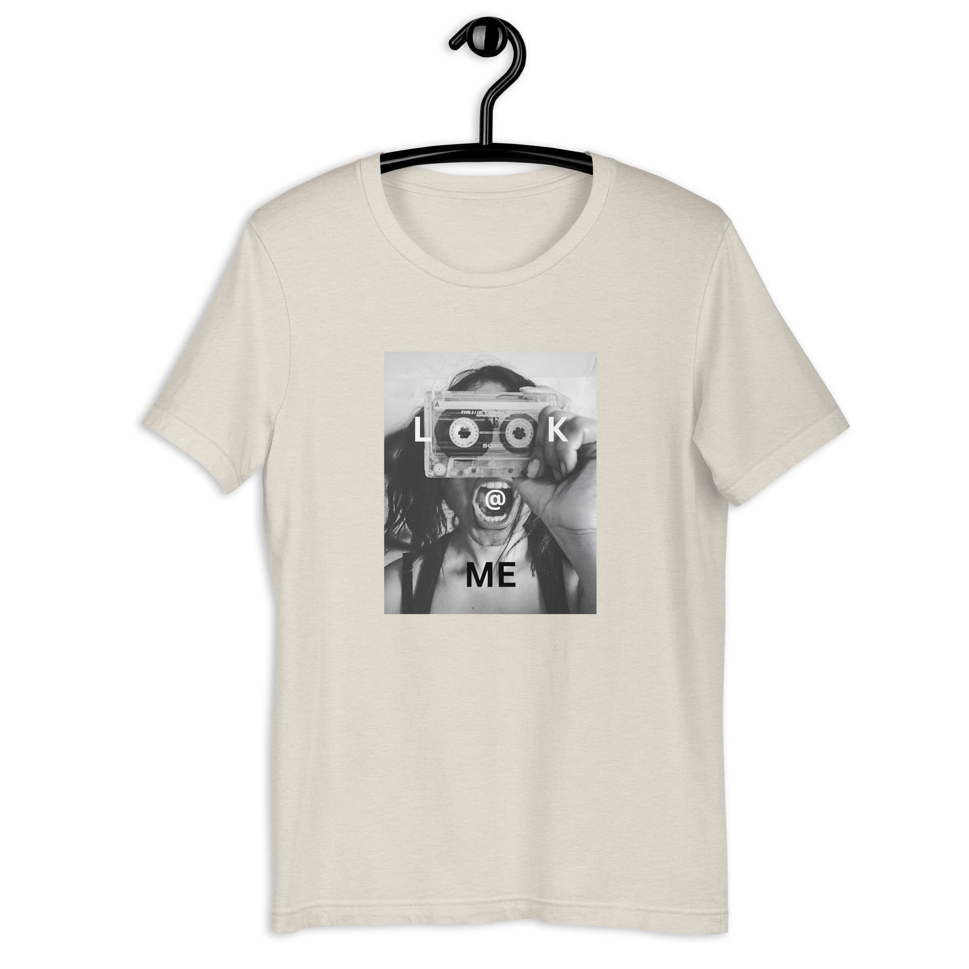 Monochrome tee featuring a woman holding a cassette like a camera in a striking design.