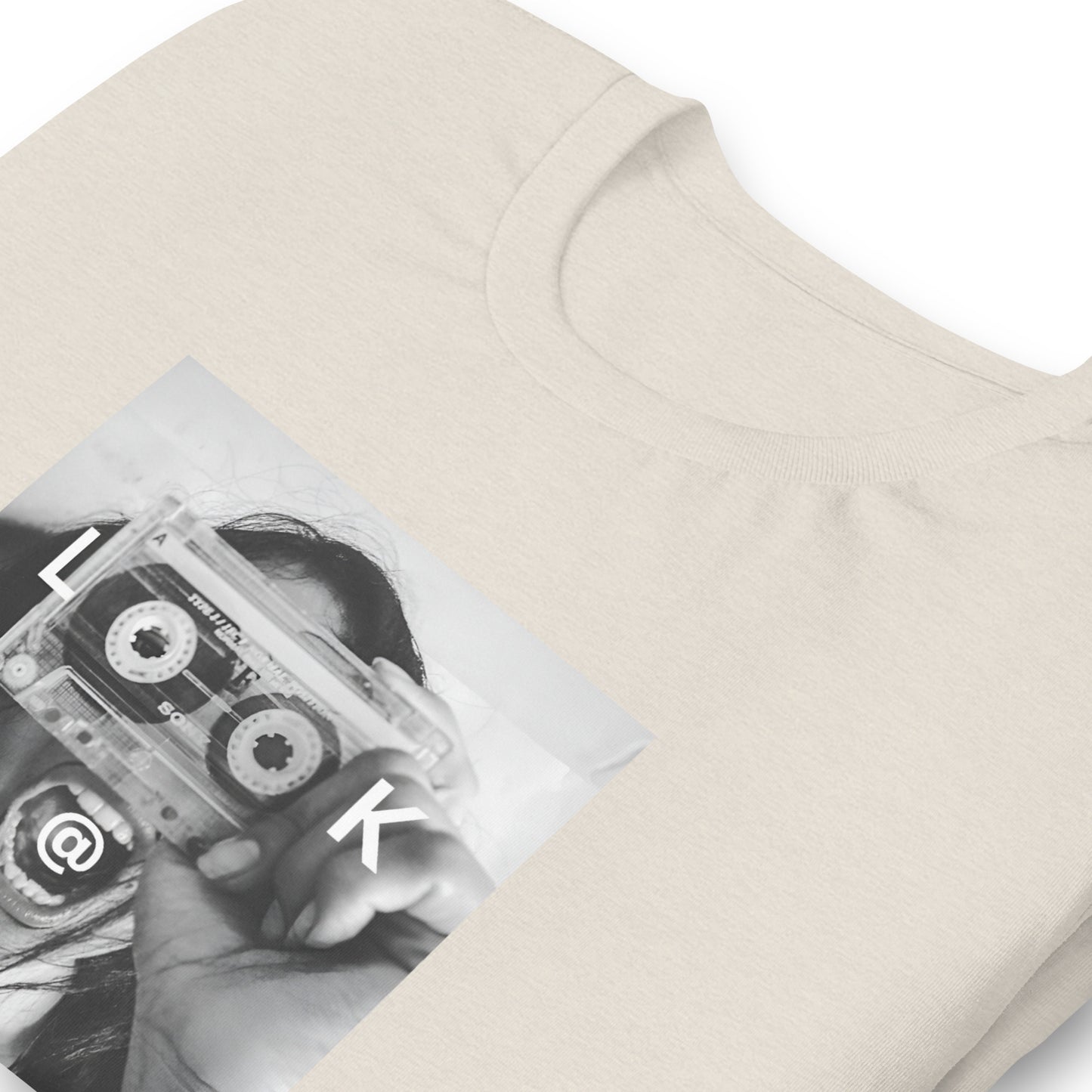 Black and white tee with a woman holding a cassette like a camera printed on front