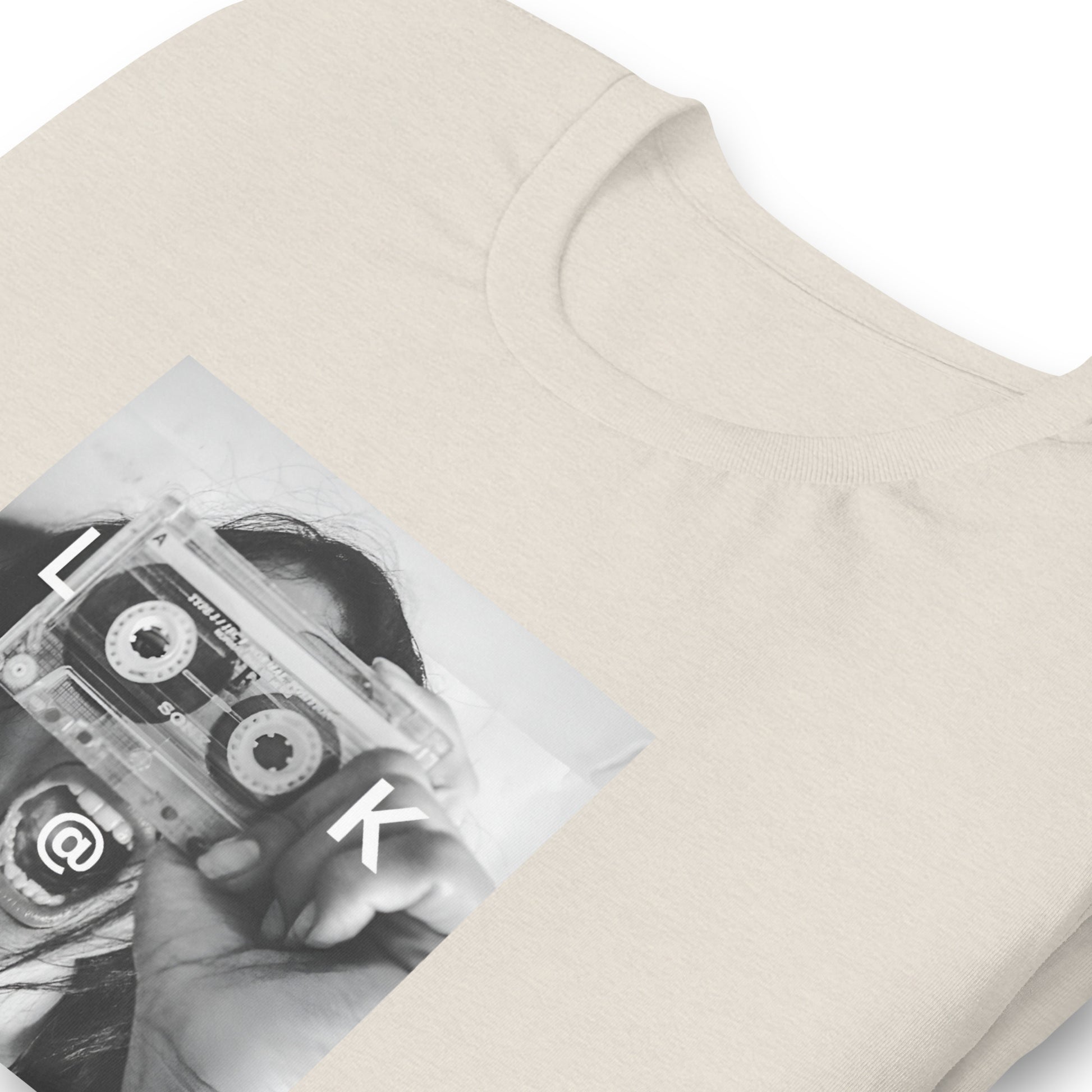 Black and white tee with a woman holding a cassette like a camera printed on front